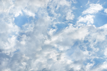 Beautiful sunlit clouds in the blue sky