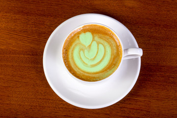 Green cappuccino with cream