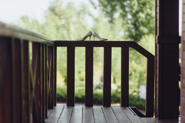 Women's wedding shoes stand in profile. Accessories of the bride. Preparing for a wedding, a date. Natural background.