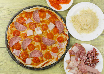 Fresh raw Italian pizza during cooking. Ingredients for pizza.