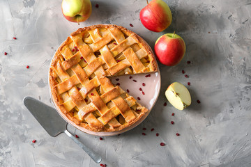 Composition with delicious apple pie on grey background
