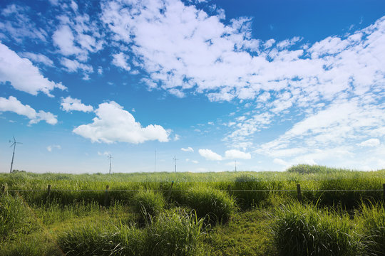 An image of nature consisting of cloudy sky and fields