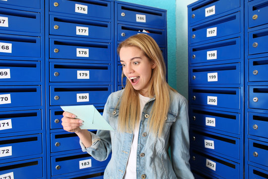 Young Woman Checking Her Mail