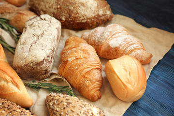 Different bakery products on wooden table