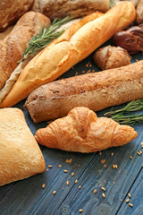 Different bakery products on wooden table