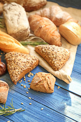 Different bakery products on wooden table