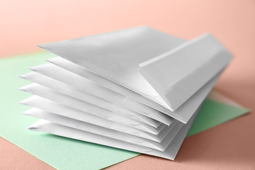 Mail envelopes on color background, closeup