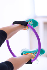 Woman doing pilates ring workout