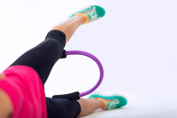 Woman doing pilates ring workout