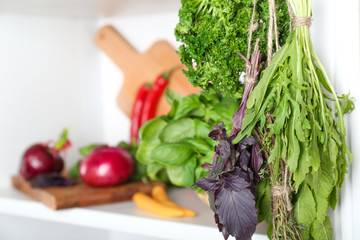 Bunches of different herbs in kitchen