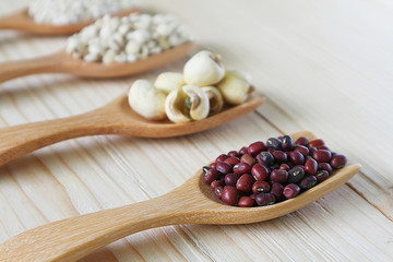 Dry millet seed with blur mix cereal on wood table.