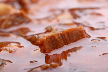 Beef stew in a pot close-up