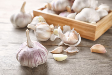 Fresh garlic on wooden background