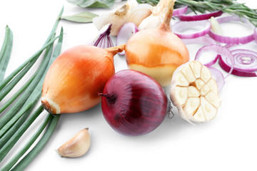 Fresh onions with garlic on white background