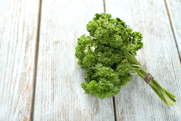 Fresh parsley on wooden background