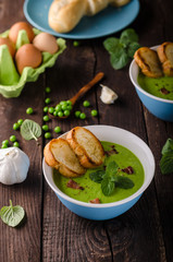 Pea soup, fresh herbs and bacon