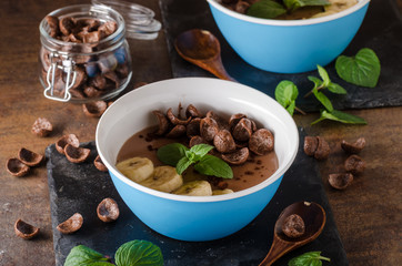 Chocolate pudding, banana and herbs in