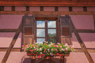 .Traditional windows of half-timbered houses in Alsace. Riboville. France.