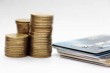 Finance concept,stack of currency coin and credit card on the desk.