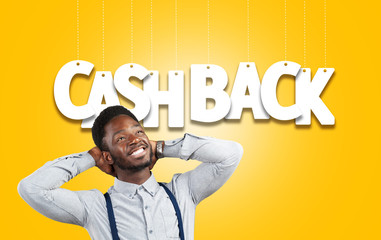 Portrait of a surprised African American man with Cashback text above his head