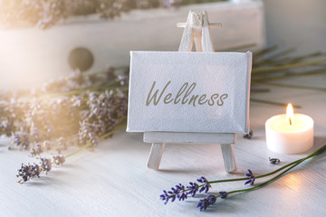 Spa or wellness still life: little image with lot of lavender in front of vintage wooden furniture...