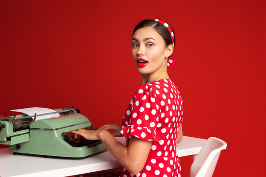 pin up girl typing on a typewriter