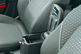 Open storage box between front car seats