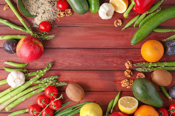Frame made of various healthy products on wooden background