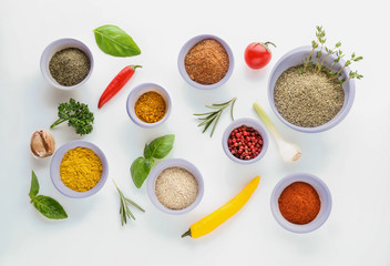 Composition with various spices and herbs on white background