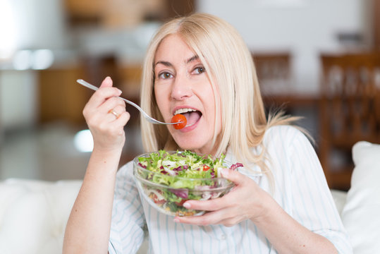 Woman Eating A Salad