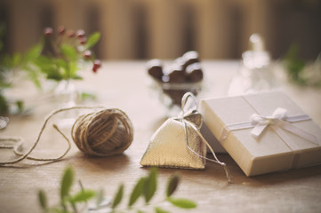 Christmas preparattions. Shiny silver bag and white box closeup