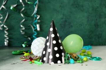Birthday party items with candies on table