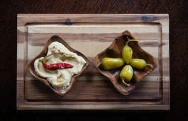 Hummus pasta and marinated chili peppers