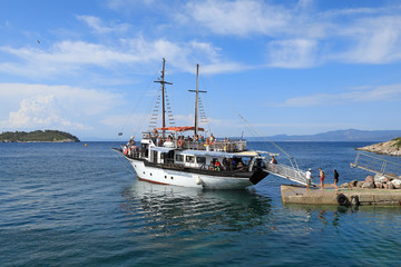 A pleasure cruise ship stands at the pier of the Kassandra Peninsula