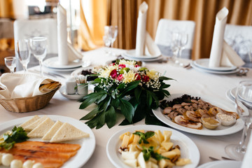 Beautiful tableware, flowers and candles decor decoration