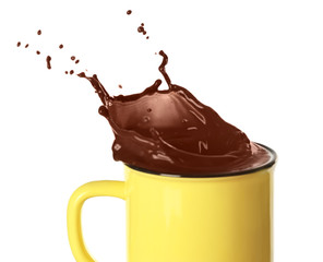 Splash of cocoa in cup on white background