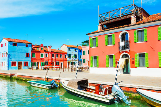 Scenic canal with colorful buildings in Burano, Venice, Italy