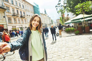 beautiful woman tourist walks to the center of the old Lviv