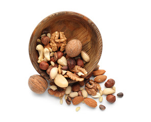 Bowl with different nuts on white background