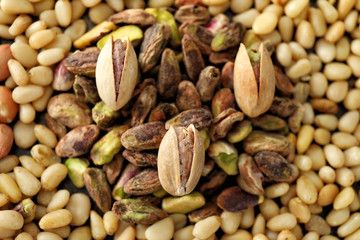 Tasty fresh pistachio and pine nuts, closeup