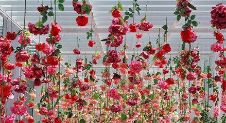 Wedding ceremony decoration with many artificial flower hanging from ceiling. Beautiful Upside down...