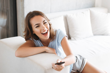 Close up of a laughing young woman relaxing
