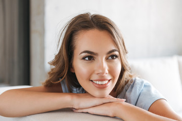 Fototapeta premium Close up of a smiling young woman relaxing