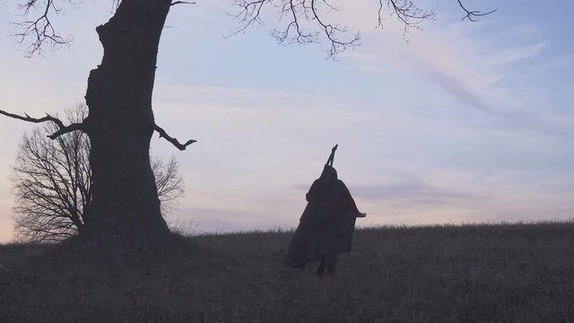 Grim Reaper sunset silhouette. concept of death
