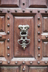 detail of the handle in a wooden door