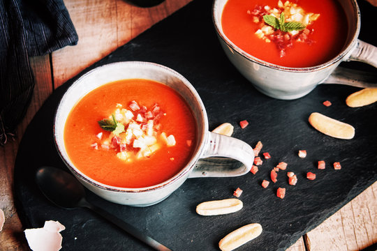 Tomato gazpacho served with egg and ham in cups