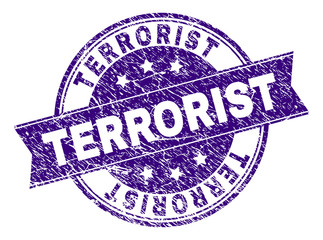 TERRORIST stamp seal imprint with grunge texture. Designed with ribbon and circles. Violet vector rubber print of TERRORIST caption with dirty texture.