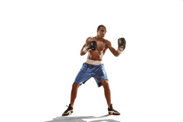 Sporty man during boxing exercise. Photo of boxer on white background