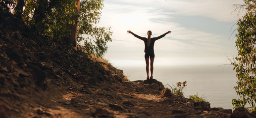 Female runner feeling strong confident