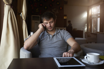 Successful experienced administrative manager talking on phone with executive fulfilling tasks...
